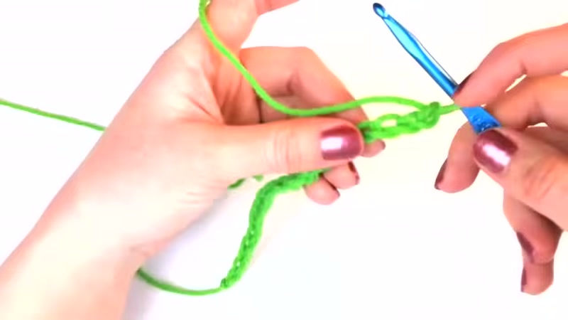 Step 5: Yarn Over and Pull Through First Two Loops